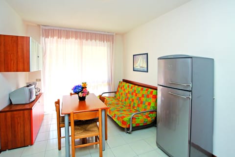 Apartment, 1 Bedroom | Living area | 22-inch TV with satellite channels