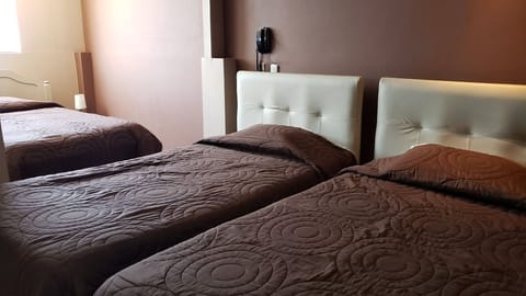 Family Room | Premium bedding, down comforters, minibar, in-room safe