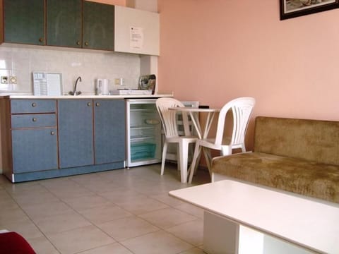 Standard Room, City View | Living area | TV