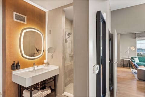 Suite, 1 King Bed | Bathroom | Shower, hair dryer, bathrobes, towels