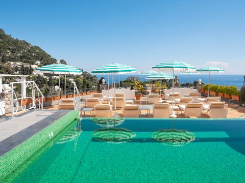 Seasonal outdoor pool, pool umbrellas, sun loungers