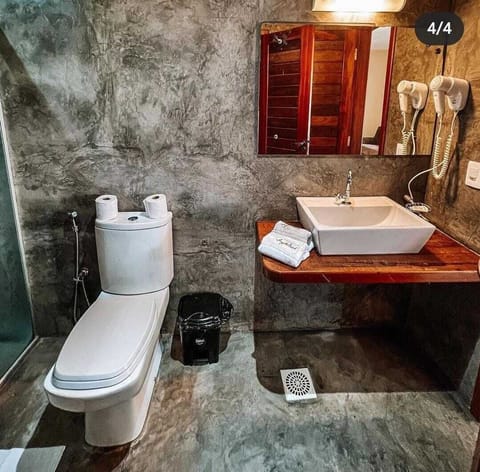 Standard Apartment, Garden View | Bathroom | Shower, hair dryer, towels