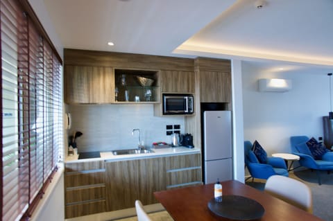 Luxury Studio Suite | Private kitchen | Microwave, coffee/tea maker, electric kettle, toaster