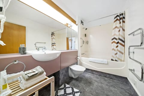 Apartment, 1 Bedroom | Bathroom | Combined shower/tub, deep soaking tub, hair dryer, towels