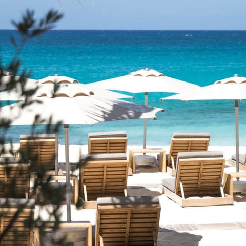 Beach nearby, white sand, sun loungers, beach umbrellas