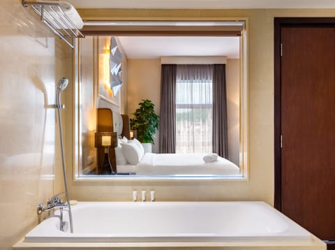 Deluxe Suite, 1 King Bed (Eastin) | Bathroom | Shower, free toiletries, hair dryer, slippers