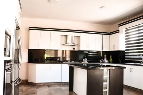 The Homestead Villa | Private kitchen | Fridge, microwave, oven, stovetop