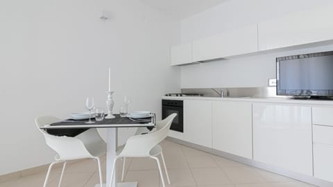 Apartment, 1 Bedroom (Stella Marina) | Private kitchen | Full-size fridge, oven, stovetop, dishwasher