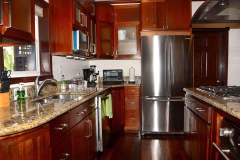 Deluxe Suite, 1 Bedroom (Namaste) | Private kitchen | Fridge, microwave, coffee/tea maker, electric kettle