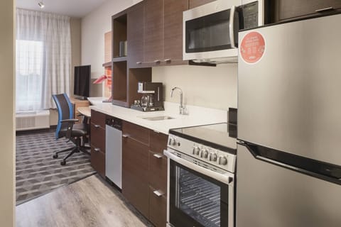 Suite, 1 Bedroom, City View | Private kitchen | Full-size fridge, microwave, stovetop, dishwasher