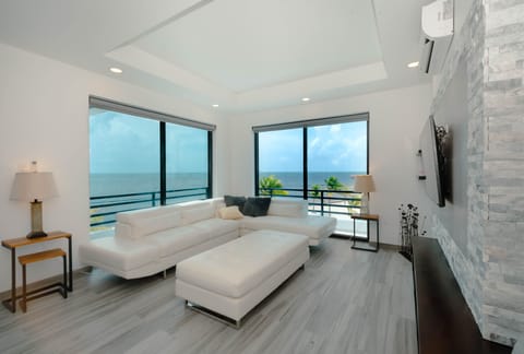 Deluxe Penthouse, Pool Access, Sea View | Living area | Flat-screen TV