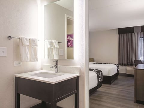 Room, 2 Queen Beds, Non Smoking | Bathroom | Combined shower/tub, free toiletries, hair dryer, towels