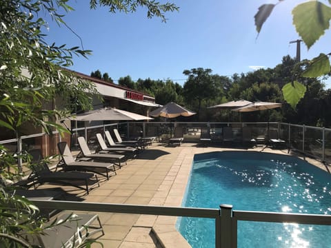 Outdoor pool, open 9:00 AM to 7:00 PM, pool umbrellas, sun loungers