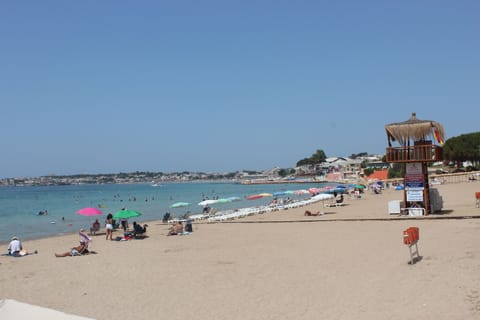 Beach nearby, beach umbrellas, beach volleyball