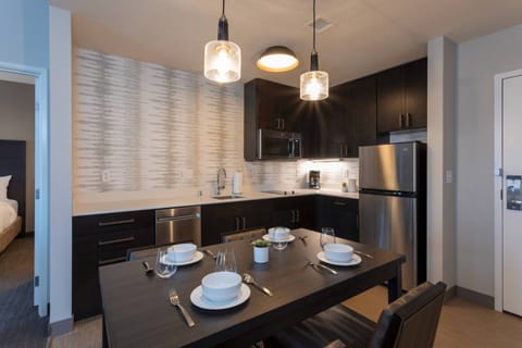 Suite, 1 Bedroom | Private kitchen | Fridge, microwave, stovetop, dishwasher