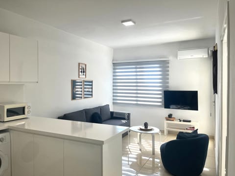 Apartment, Sea View | Living area | Flat-screen TV