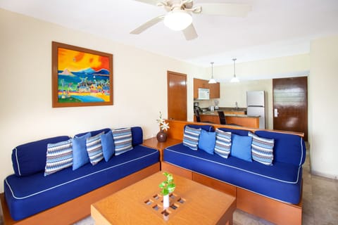 Two Bedroom Family Suite Pool View | Living area | 32-inch flat-screen TV with cable channels, TV