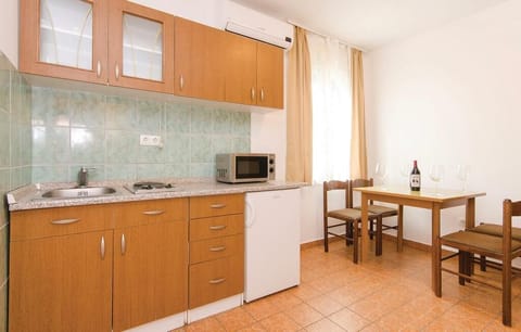 Apartment (Apartments Čiovo - Standard Two Bedr) | Private kitchen | Fridge, microwave, stovetop, coffee/tea maker