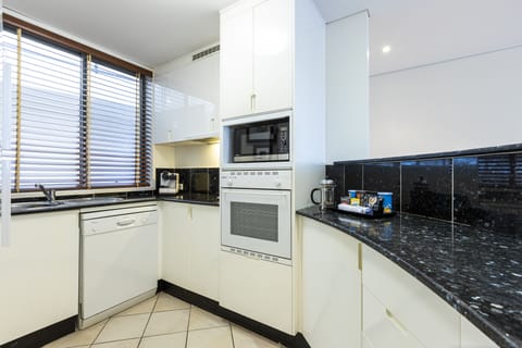 Apartment Eleven (2 Bedrooms) | Private kitchen | Full-size fridge, microwave, oven, stovetop