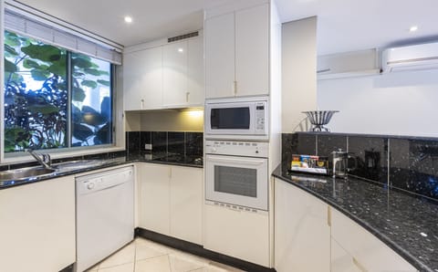 Apartment Six (2 Bedrooms) | Private kitchen | Full-size fridge, microwave, oven, stovetop