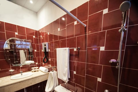 Double Room, Courtyard View (#4) | Bathroom | Shower, rainfall showerhead, hair dryer, towels