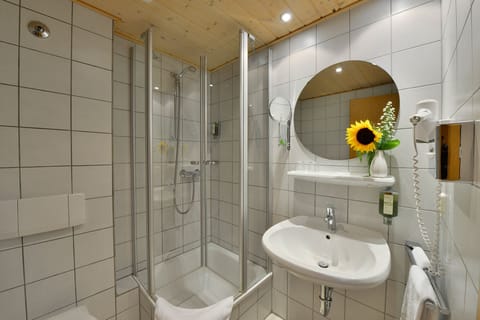 Double Room, Balcony (sunny side) | Bathroom | Shower, hair dryer, towels