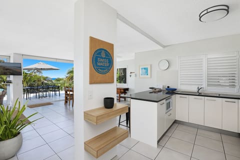 Andari Offsite Apartment Ocean Views (2/11 Belmore) | Private kitchen | Full-size fridge, microwave, oven, stovetop