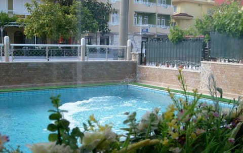 Seasonal outdoor pool, pool umbrellas, sun loungers