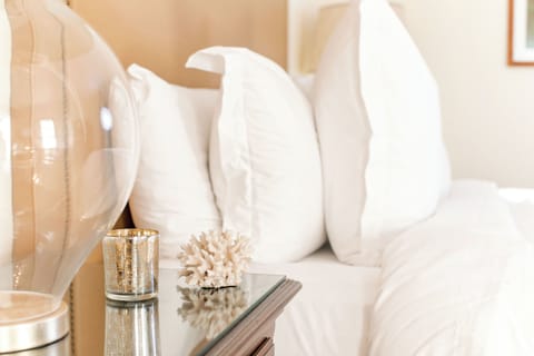 Premium bedding, down comforters, pillowtop beds, in-room safe