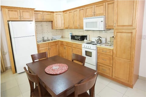 Suite, 1 Bedroom | Private kitchen | Full-size fridge, microwave, stovetop, dishwasher