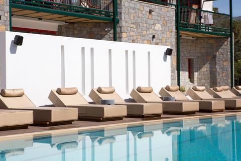 Seasonal outdoor pool, open 9 AM to 7 PM, pool umbrellas, sun loungers