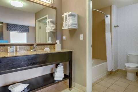 Two queen studio suite | Bathroom | Bathtub, hair dryer