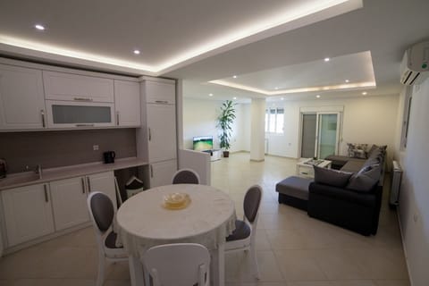 Apartment, 3 Bedrooms | Living area | Flat-screen TV