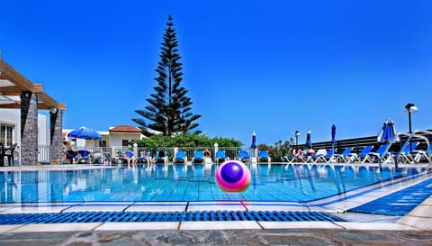 Seasonal outdoor pool, open 9:00 AM to 8:00 PM, pool umbrellas