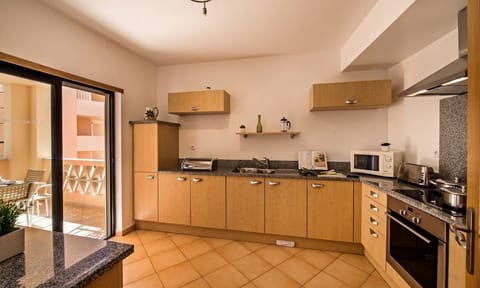 Apartment, 3 Bedrooms | Private kitchen | Full-size fridge, microwave, oven, stovetop