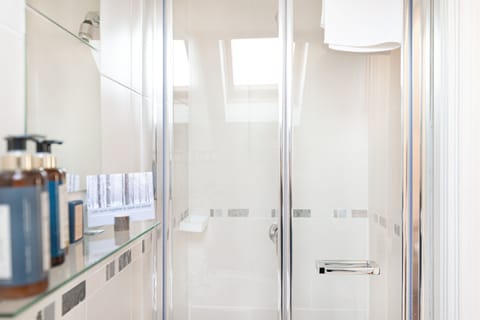 Designer toiletries, hair dryer, bathrobes, slippers