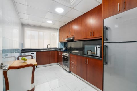 Two Bedroom Apartment | Private kitchen | Electric kettle, dining tables