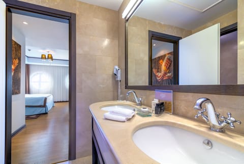 Epoque VIP Suite | Bathroom | Rainfall showerhead, designer toiletries, hair dryer, bathrobes