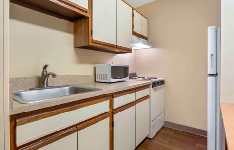 Studio, 1 Queen Bed, Non Smoking | Private kitchen | Full-size fridge, microwave, stovetop