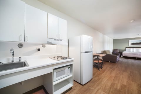 Suite, 1 King Bed, Non Smoking | Private kitchenette | Full-size fridge, microwave, stovetop