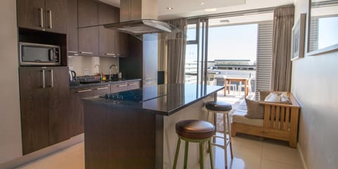 Studio, 1 King Bed | Private kitchen | Full-size fridge, microwave, stovetop, dishwasher