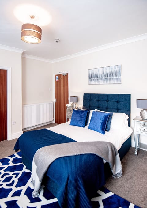 Individually furnished, desk, laptop workspace, blackout drapes