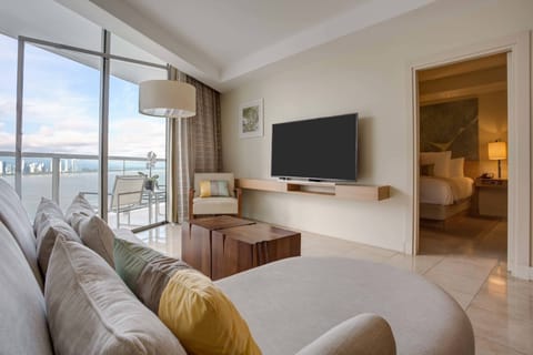 Grand Suite, 1 King Bed, Partial Ocean View | Living area | 55-inch LCD TV with cable channels, TV, pay movies