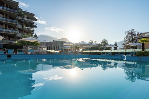 Seasonal outdoor pool, pool umbrellas, sun loungers