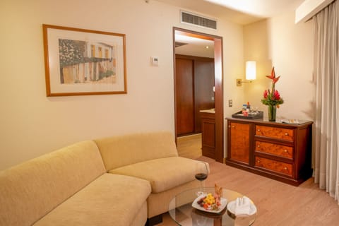 Suite, 1 King Bed | Living area | 32-inch LCD TV with cable channels, TV