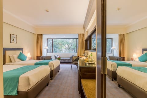 Deluxe Room, 1 Bedroom, Mountain View | Minibar, in-room safe, laptop workspace, soundproofing