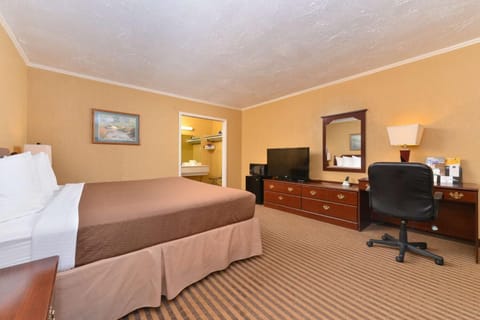 Deluxe Room, 1 King Bed | Premium bedding, desk, laptop workspace, blackout drapes