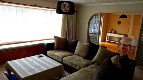 4 Bedroom Holiday House | Living area | Flat-screen TV, DVD player, iPod dock