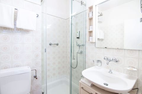 Eco-friendly toiletries, hair dryer, towels, toilet paper