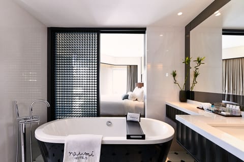 Oasis Room | Bathroom | Designer toiletries, hair dryer, bathrobes, slippers